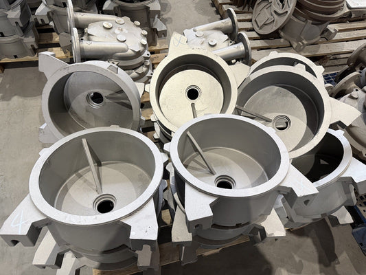 Batch of metal components staged for inspection and finishing