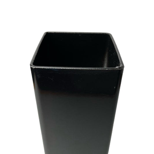 Close-up of a black square hollow steel fence post