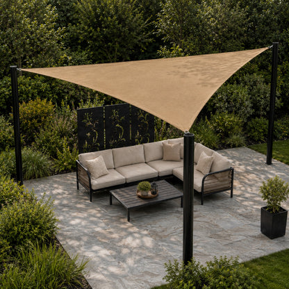 Triangle outdoor shade sail installed over a garden patio seating area