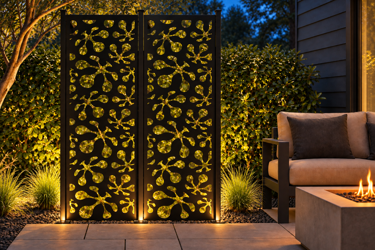 Design 255 Starburst Pebble Scatter Laser Cut Metal Privacy Screen Panel installed garden night lighting view