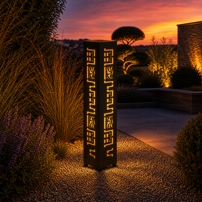 Design 002 outdoor decorative LED light column glowing at dusk in garden setting