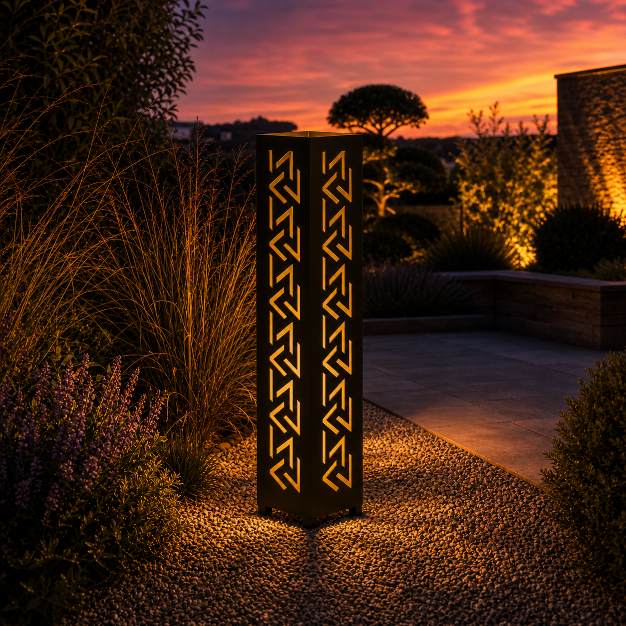 Design 004 outdoor decorative LED light column glowing at dusk in garden setting
