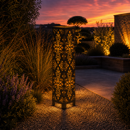 Design 005 outdoor decorative LED light column glowing at dusk in garden setting