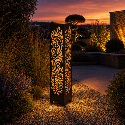 Design 008 outdoor decorative LED light column glowing at dusk in garden setting