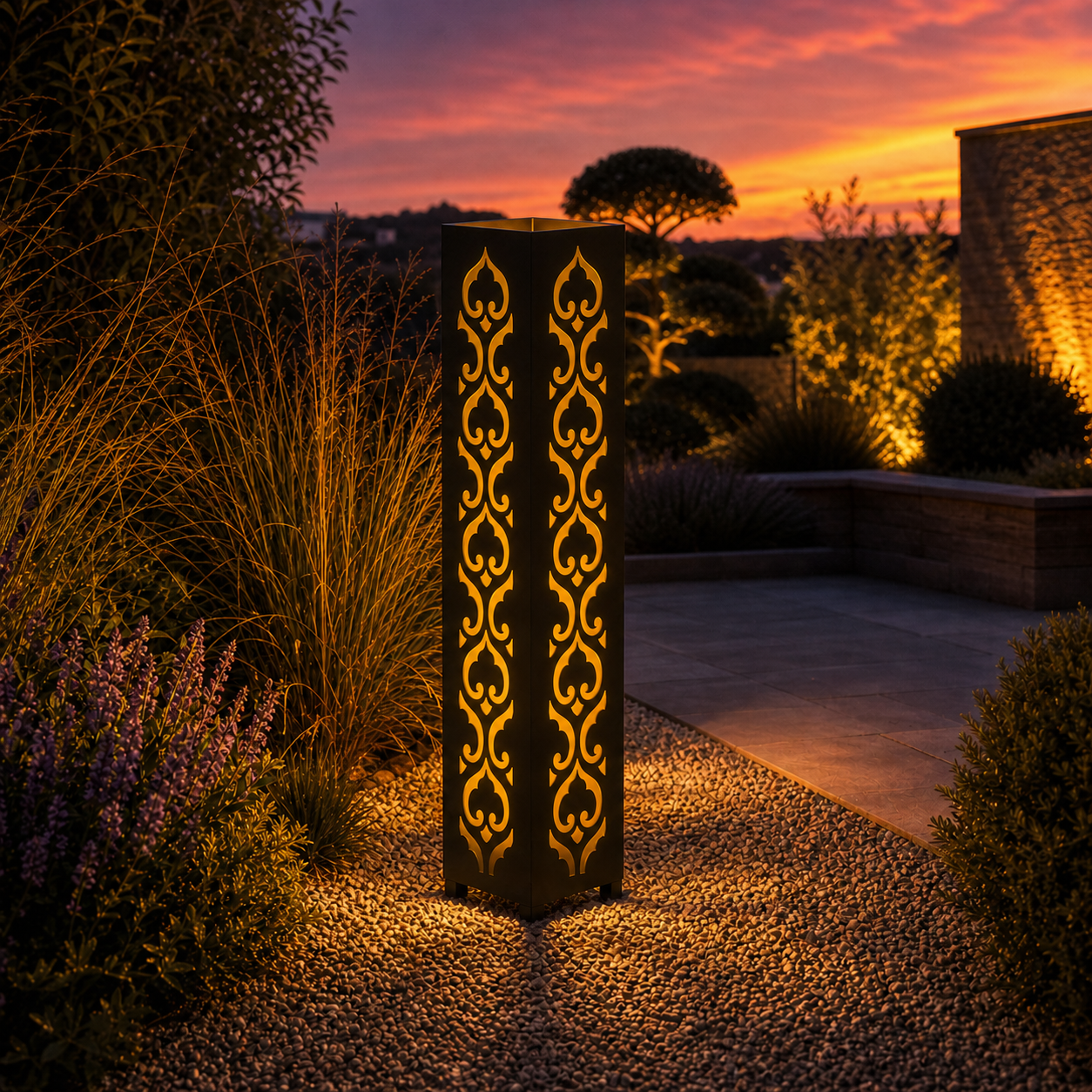 Design 009 outdoor decorative LED light column glowing at dusk in garden setting