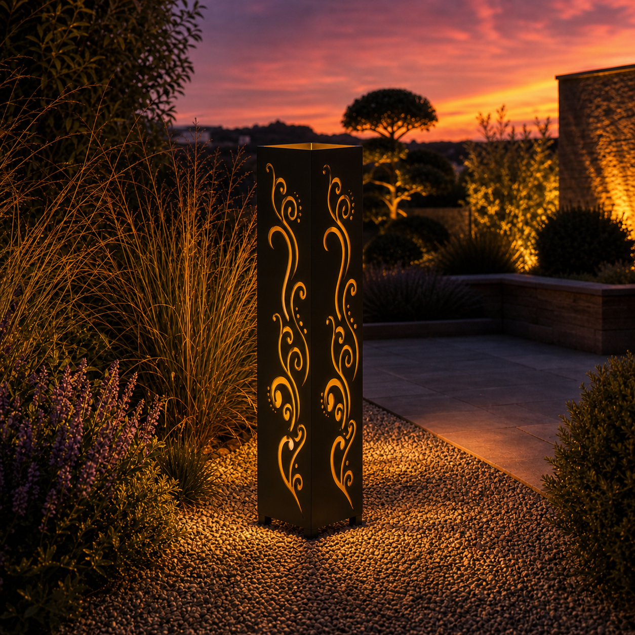 Design 010 outdoor decorative LED light column glowing at dusk in garden setting