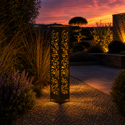 Design 011 outdoor decorative LED light column glowing at dusk in garden setting