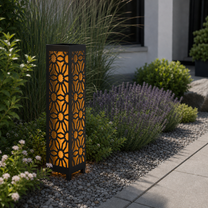 Design 027 laser cut garden light pillar installed in landscaped patio during daytime