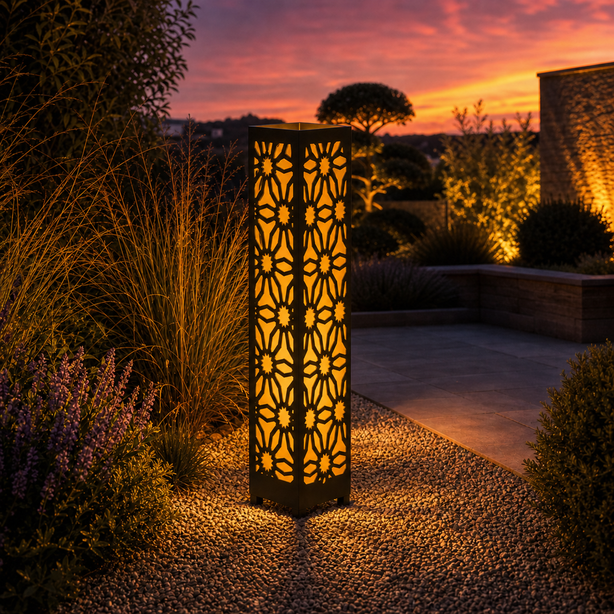 Design 027 outdoor decorative LED light column glowing at dusk in garden setting