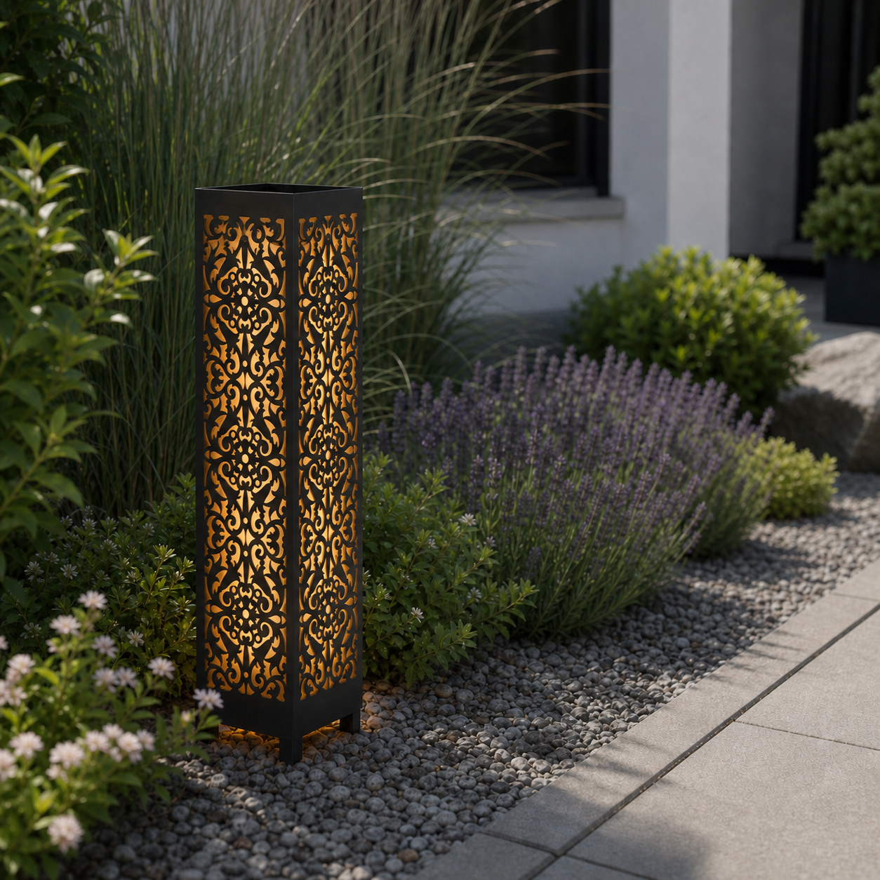 Design 040 laser cut garden light pillar installed in landscaped patio during daytime