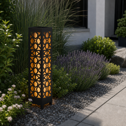 Design 044 laser cut garden light pillar installed in landscaped patio during daytime