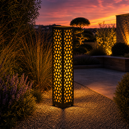 Design 045 outdoor decorative LED light column glowing at dusk in garden setting