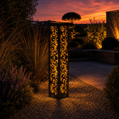 Design 059 outdoor decorative LED light column glowing at dusk in garden setting