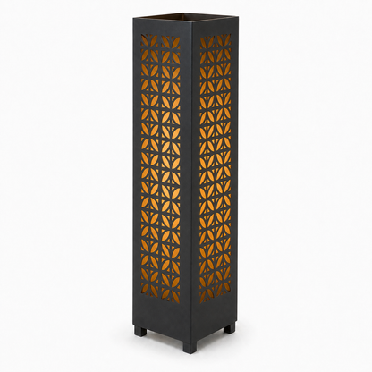 Design 060 black laser cut metal garden light tower with warm LED glow on white background