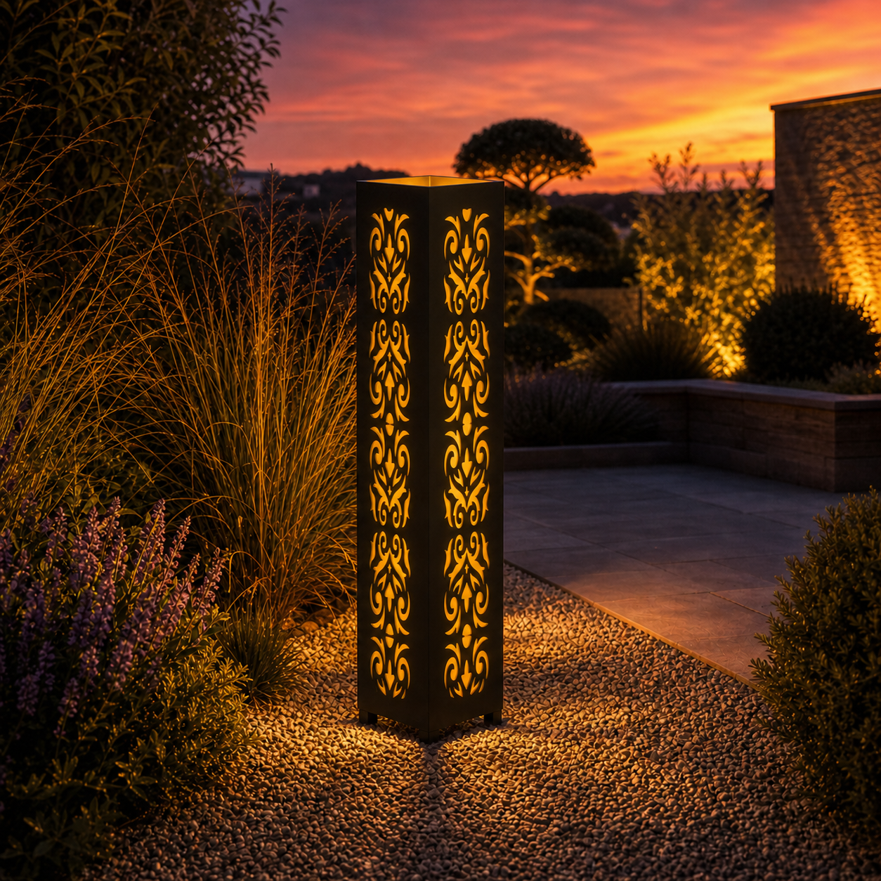 Design 061 outdoor decorative LED light column glowing at dusk in garden setting