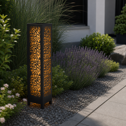 Design 100 laser cut garden light pillar installed in landscaped patio during daytime