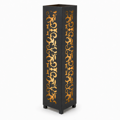 Design 101 black laser cut metal garden light tower with warm LED glow on white background