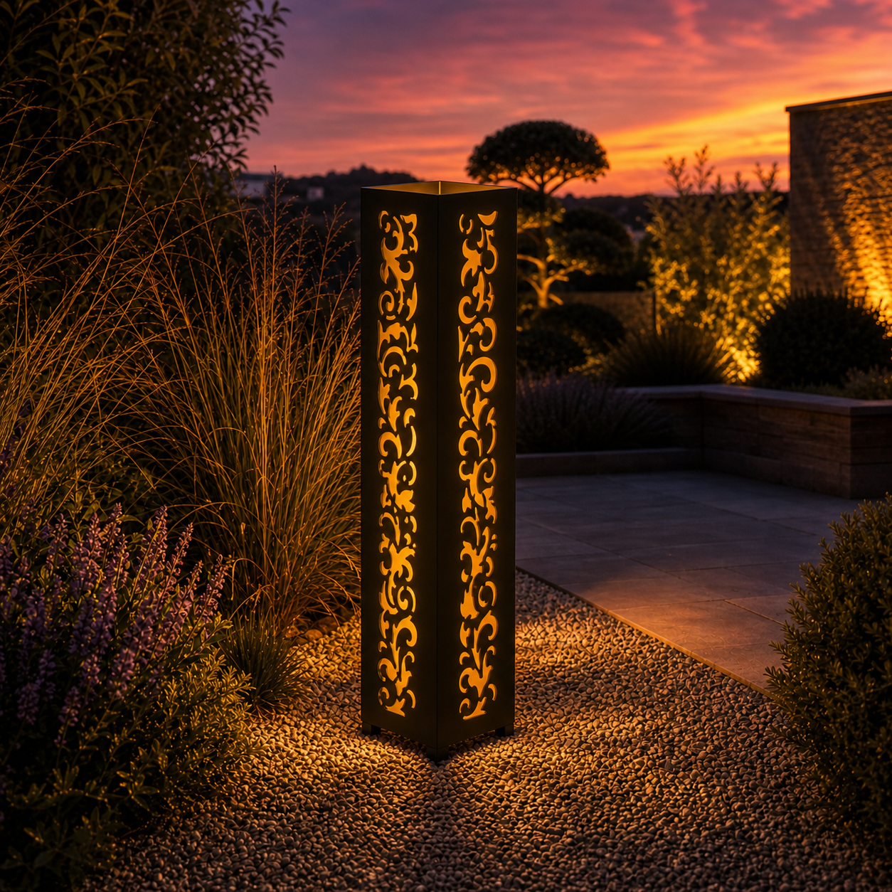 Design 101 outdoor decorative LED light column glowing at dusk in garden setting