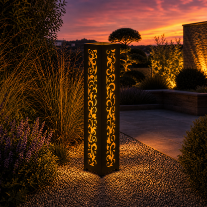 Design 101 outdoor decorative LED light column glowing at dusk in garden setting