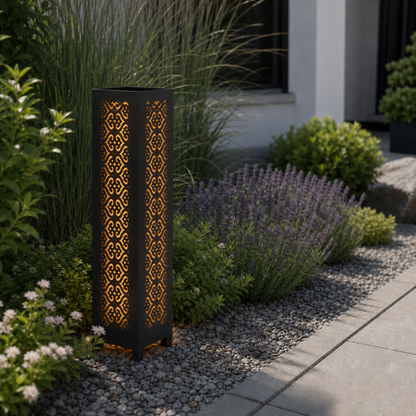 Design 104 laser cut garden light pillar installed in landscaped patio during daytime