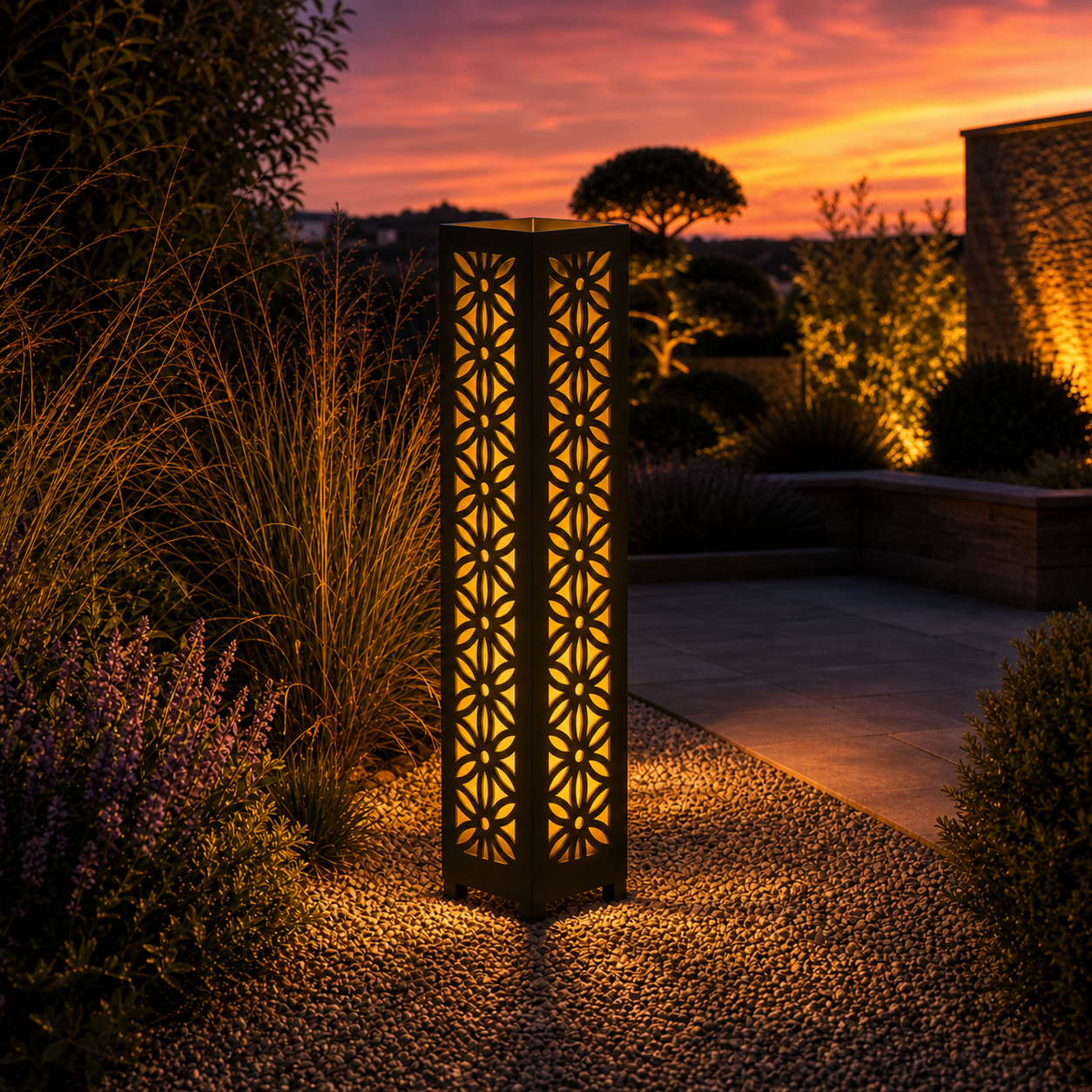 Design 106 outdoor decorative LED light column glowing at dusk in garden setting