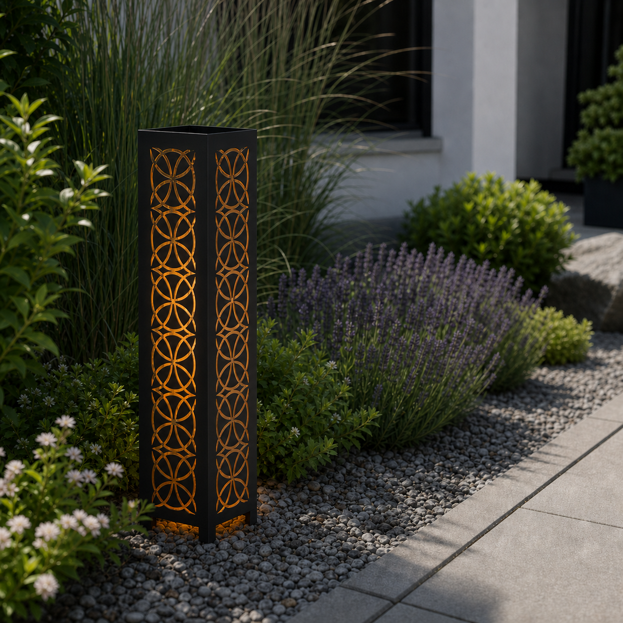 Design 107 laser cut garden light pillar installed in landscaped patio during daytime