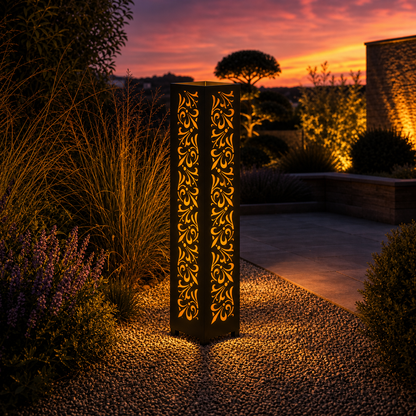 Design 108 outdoor decorative LED light column glowing at dusk in garden setting