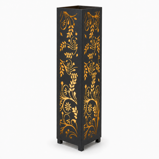 Design 110 black laser cut metal garden light tower with warm LED glow on white background