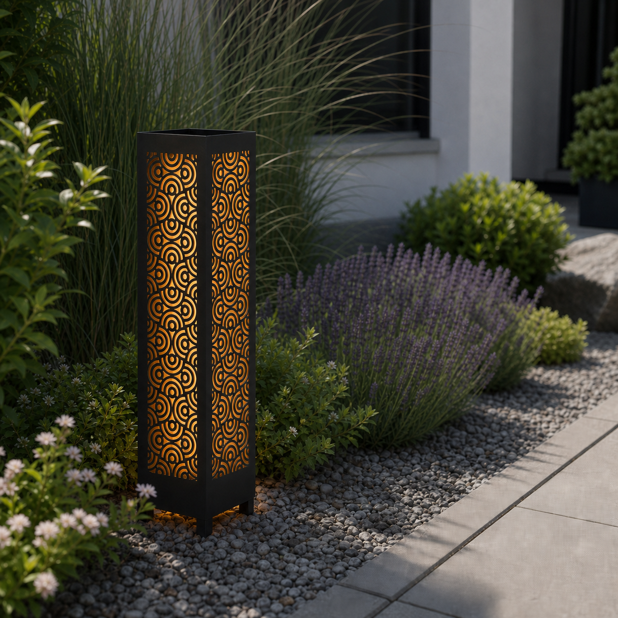 Design 112 laser cut garden light pillar installed in landscaped patio during daytime