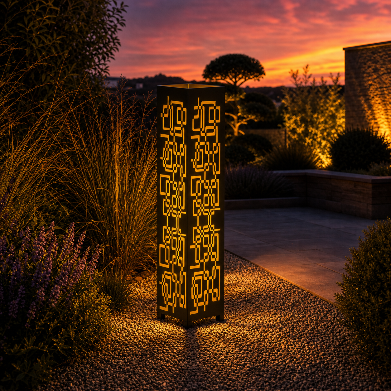 Design 114 outdoor decorative LED light column glowing at dusk in garden setting