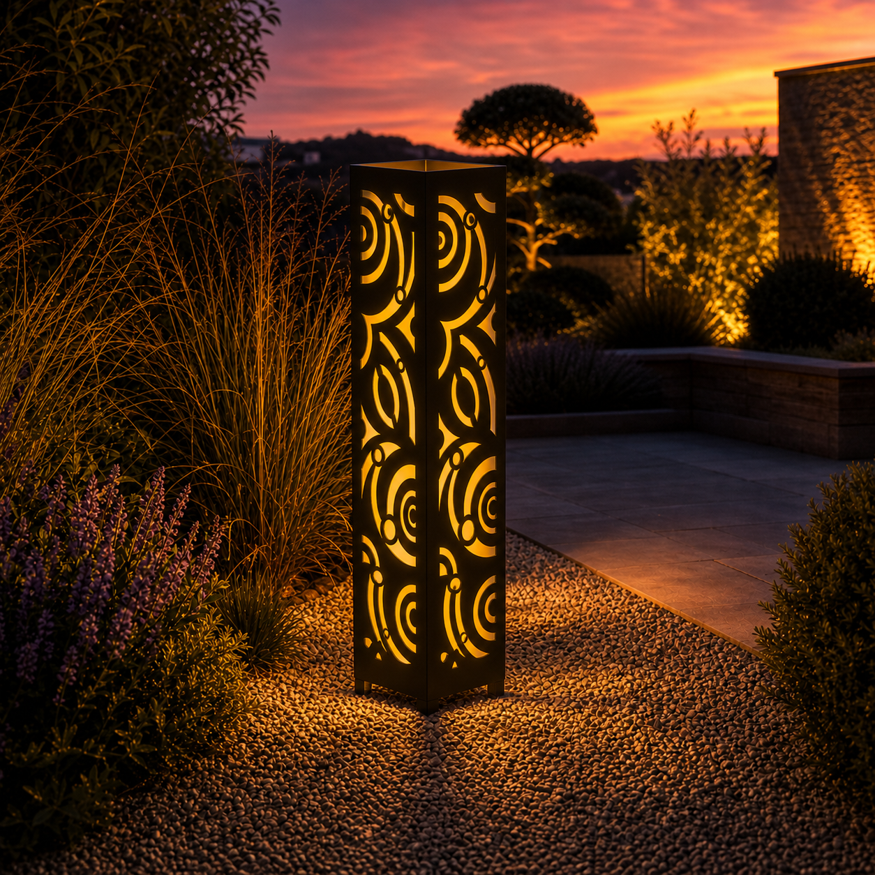 Design 115 outdoor decorative LED light column glowing at dusk in garden setting
