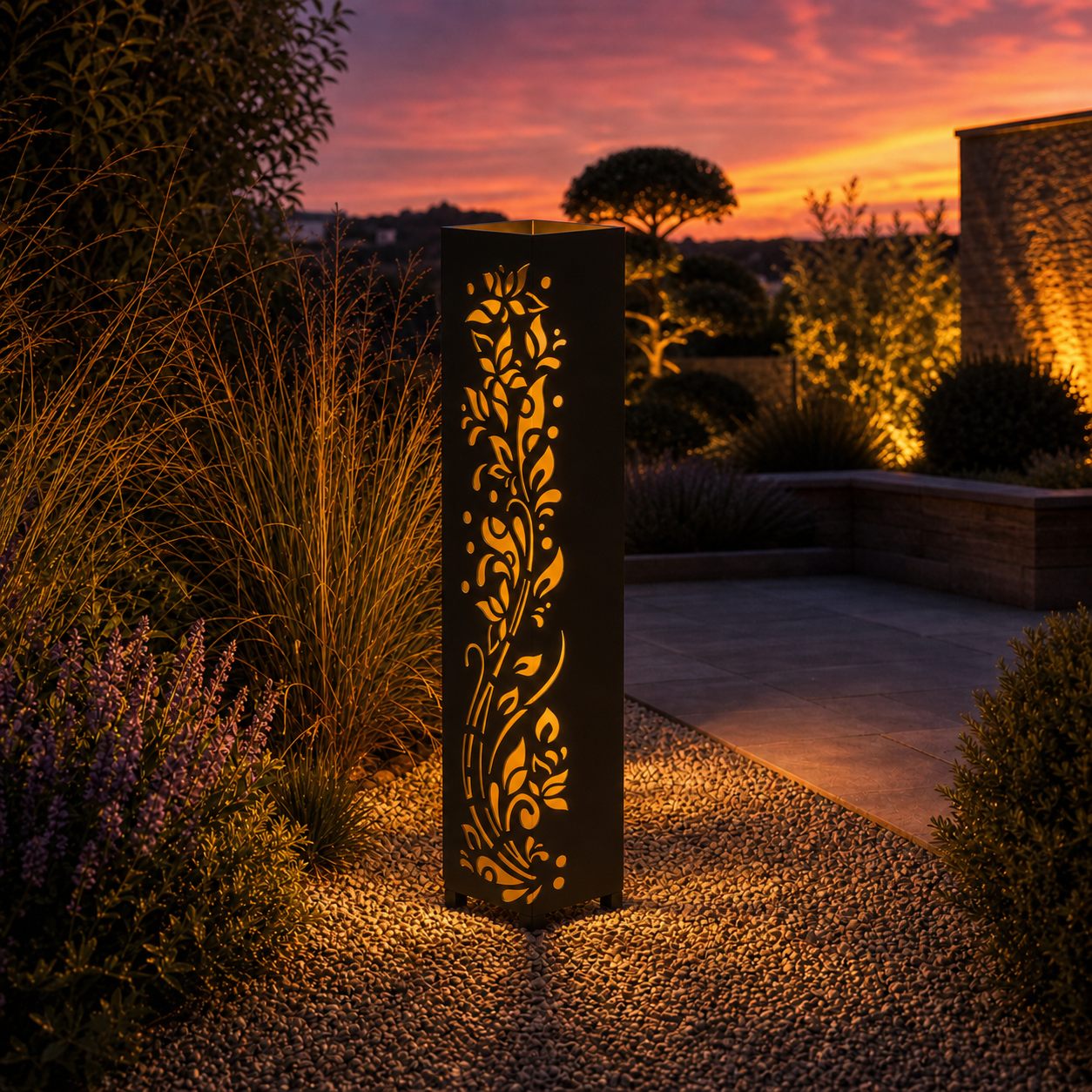 Design 116 outdoor decorative LED light column glowing at dusk in garden setting