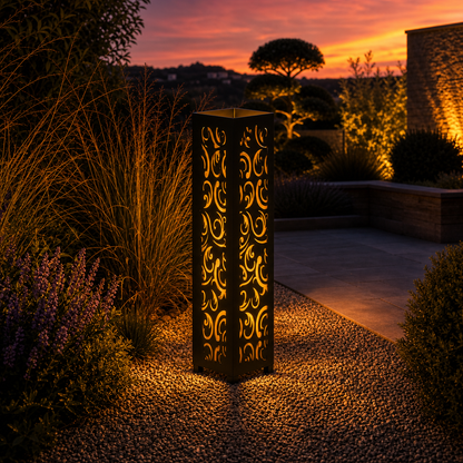 Design 120 outdoor decorative LED light column glowing at dusk in garden setting