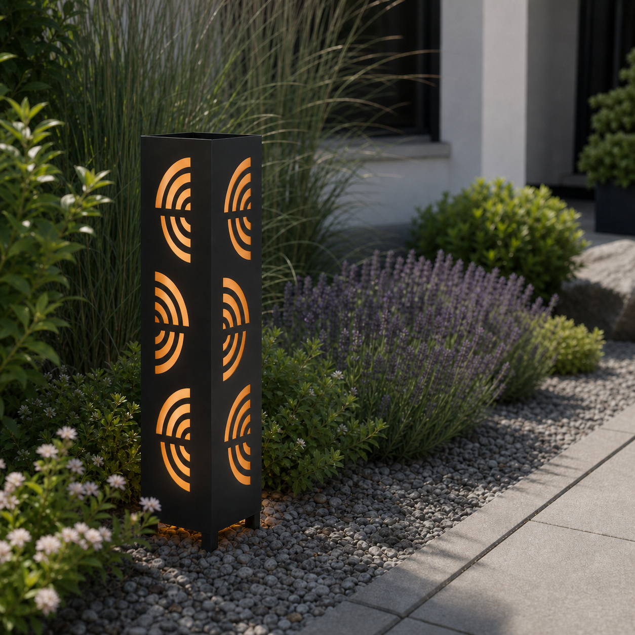 Design 121 laser cut garden light pillar installed in landscaped patio during daytime