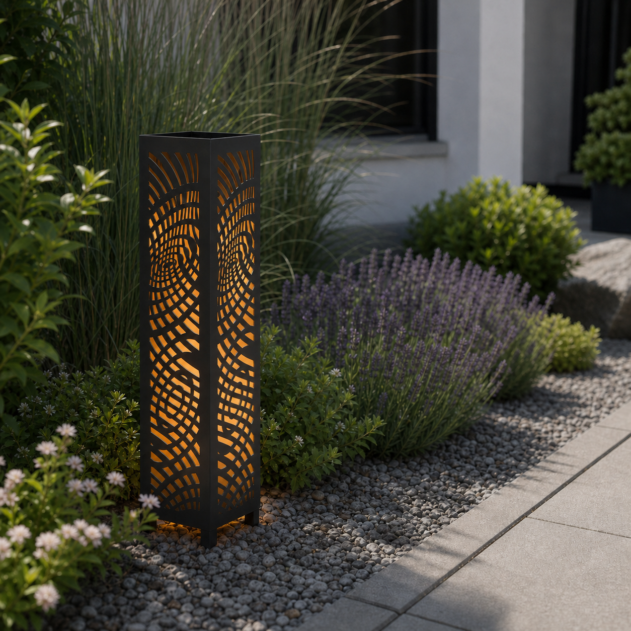 Design 137 laser cut garden light pillar installed in landscaped patio during daytime