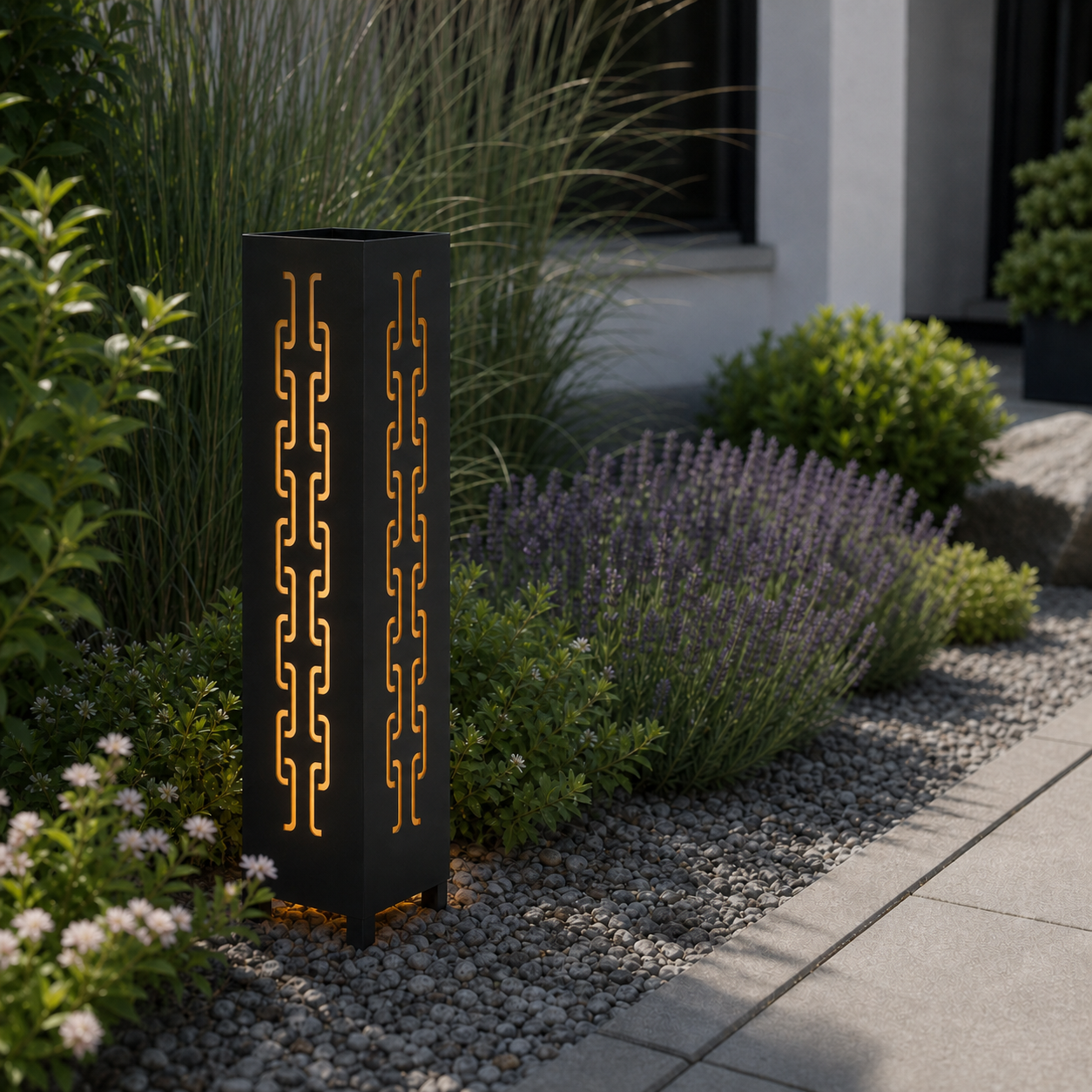 Design 141 laser cut garden light pillar installed in landscaped patio during daytime