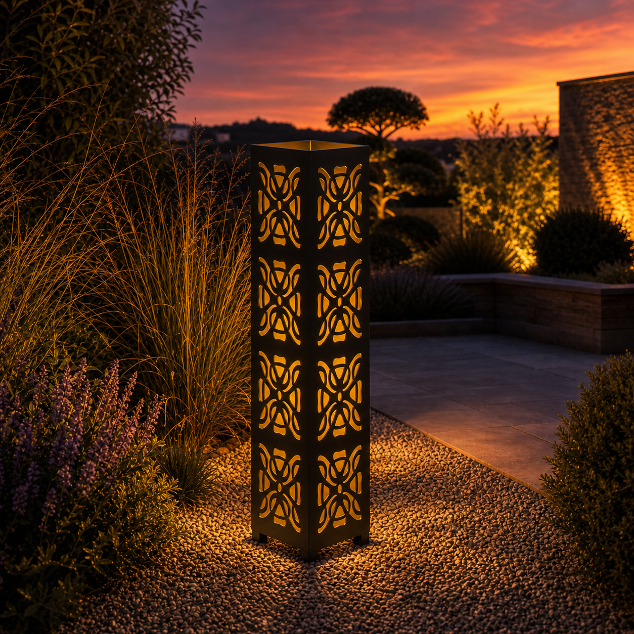 Design 153 outdoor decorative LED light column glowing at dusk in garden setting