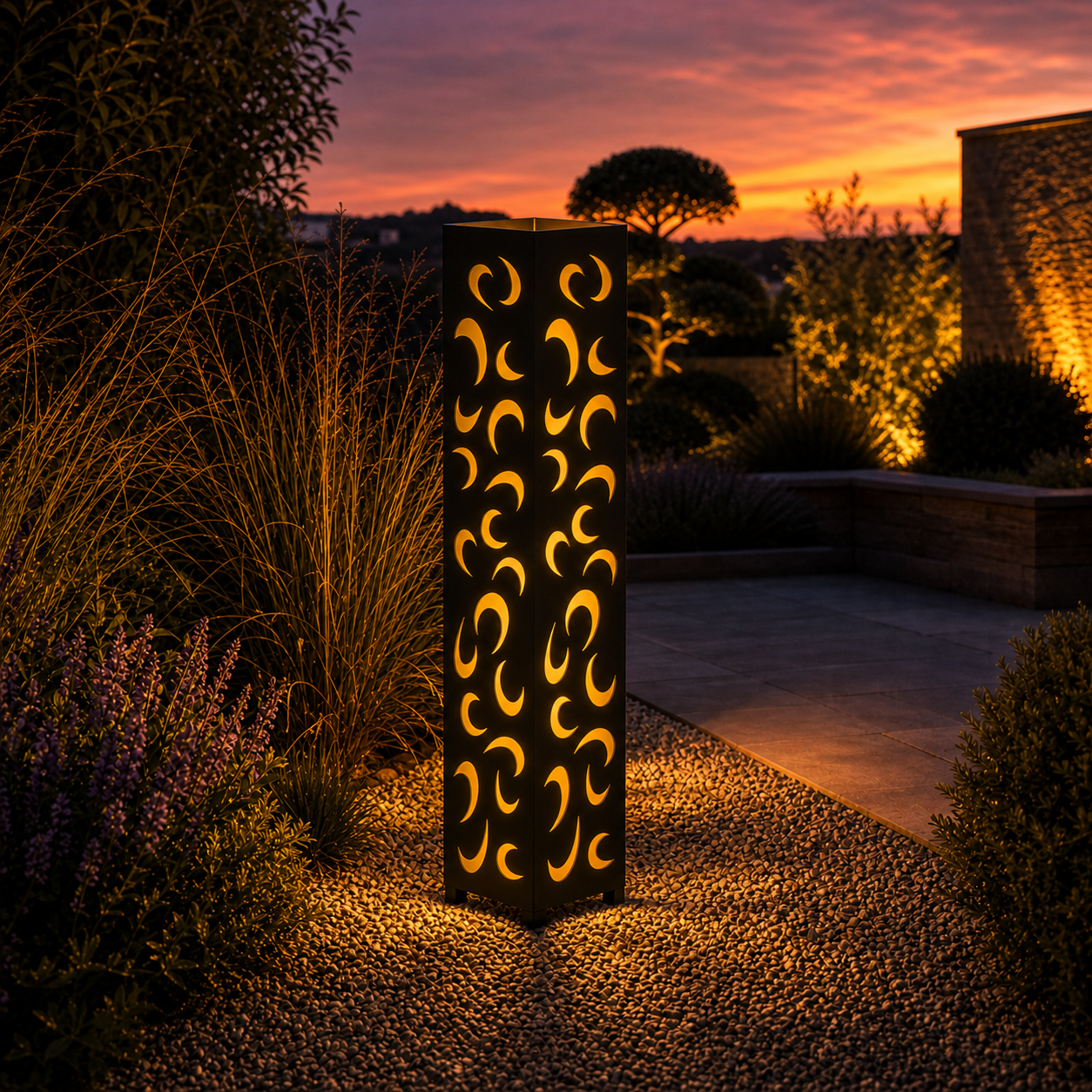 Design 157 outdoor decorative LED light column glowing at dusk in garden setting