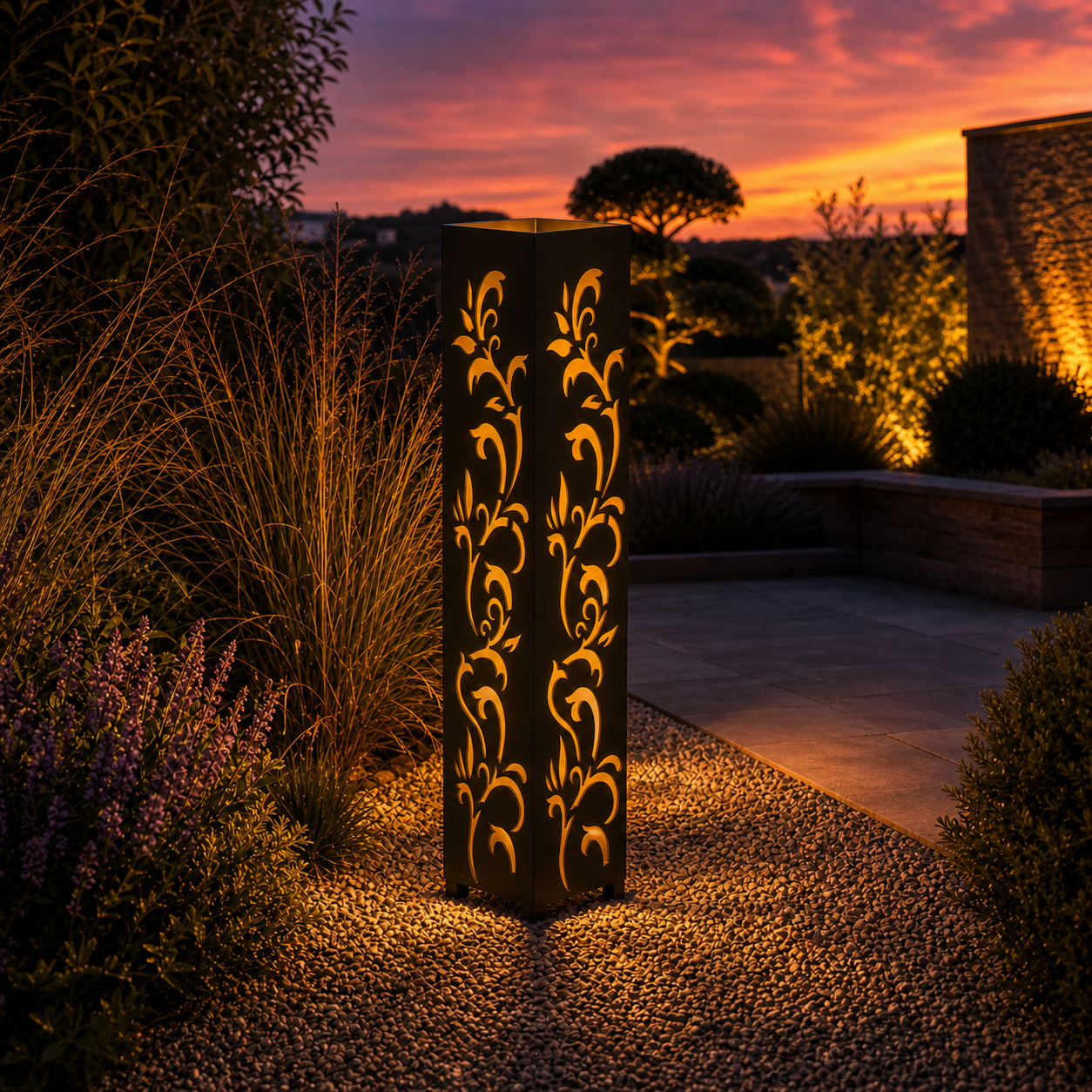 Design 159 outdoor decorative LED light column glowing at dusk in garden setting