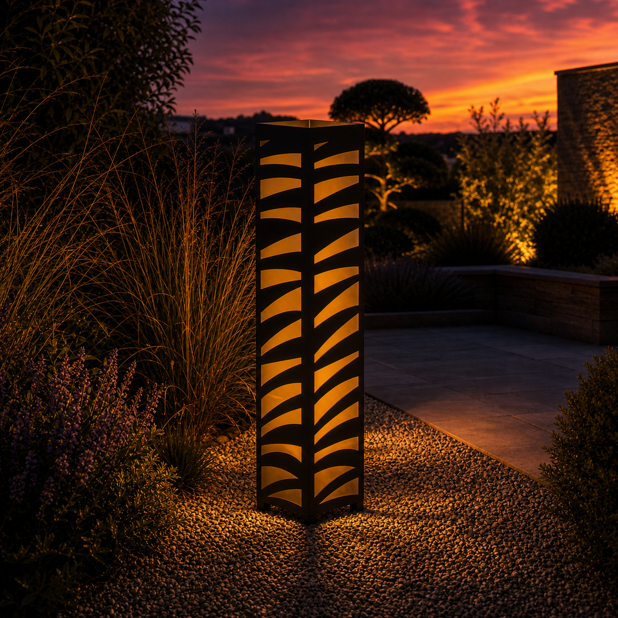 Design 160 outdoor decorative LED light column glowing at dusk in garden setting