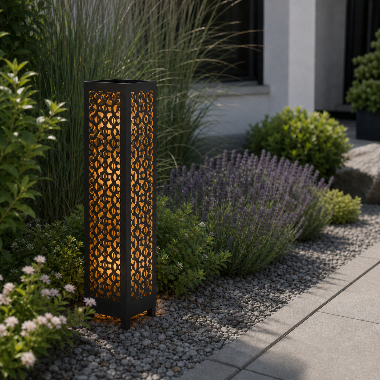 Design 175 laser cut garden light pillar installed in landscaped patio during daytime