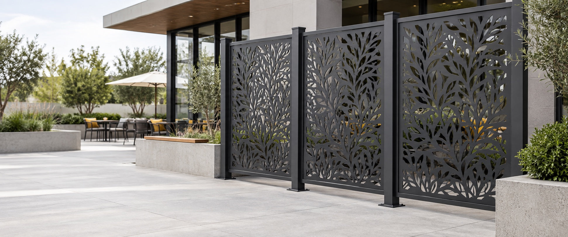 Laser cut privacy screens installed around a modern courtyard