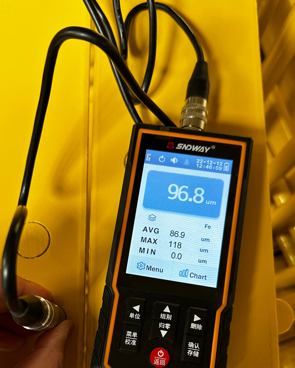 Coating thickness measurement on a powder coated metal part