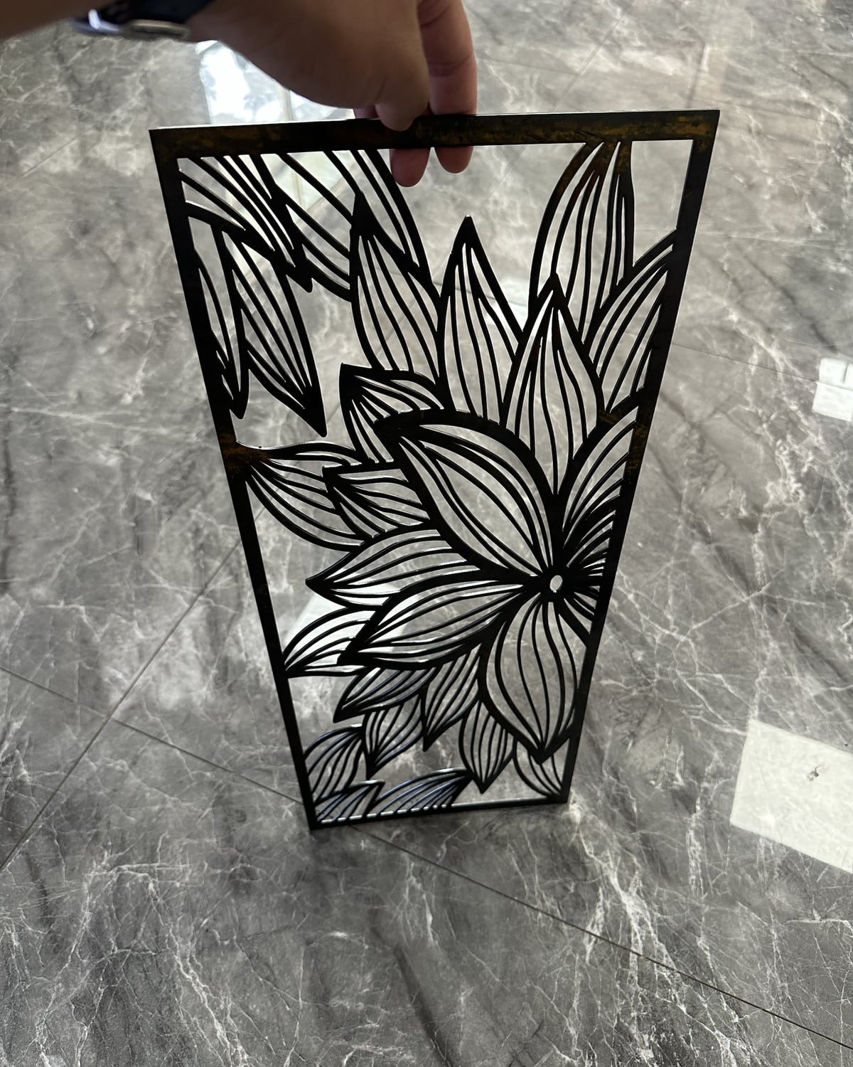 Laser cut sample panel checked before bulk production approval